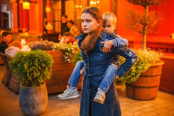 Girl with boy piggy back ride
