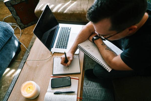 Man Writing at his Desk