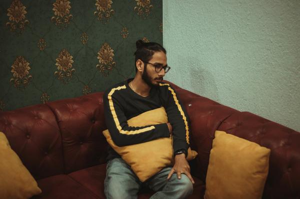Photo by Dollar Gill on Unsplash man on a couch