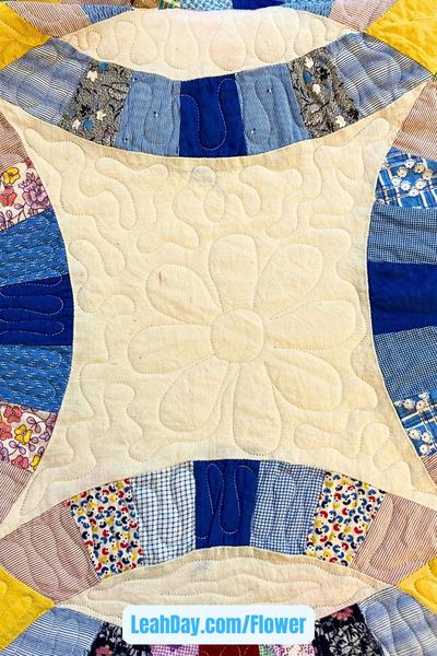 Flower Stencil quilted on Double Wedding Ring Quilt