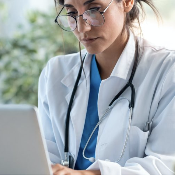 Woman doctor working on a laptop