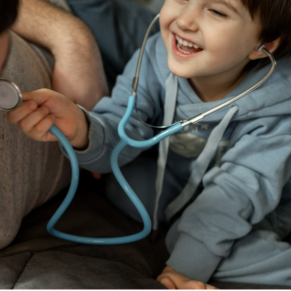 Dad and sons playing doctor