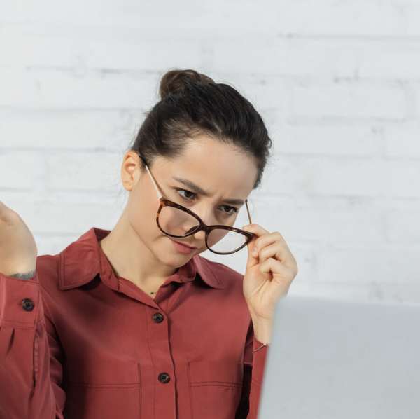 Techer adjusting eyeglasses