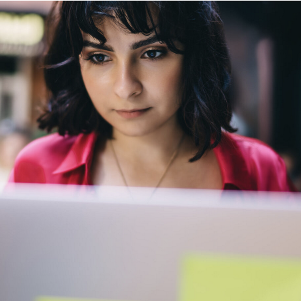 Serious woman working on computer