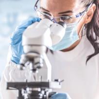 Woman Reading Microscope