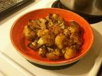 Roasted cauliflower in red bowl