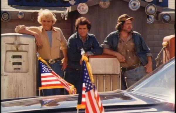 Bo, Luke, and Cooter survey “Limo One” – the official limousine of Jimmy Carter – in S1E9 of the Dukes of Hazzard. Image: Warner Bros