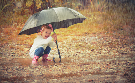 child happy in the rain