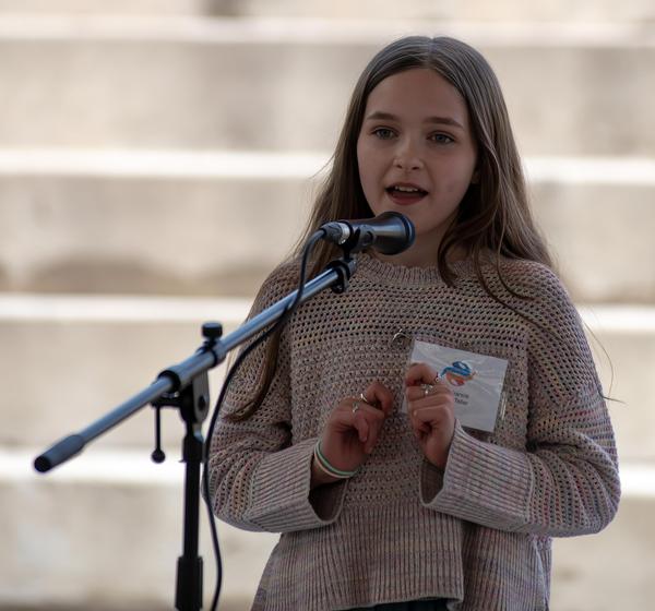 Youth teller performing at 2025 Summit & Festival