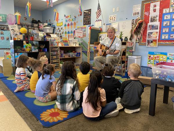 Norm Brecke performing outreach at daycare center