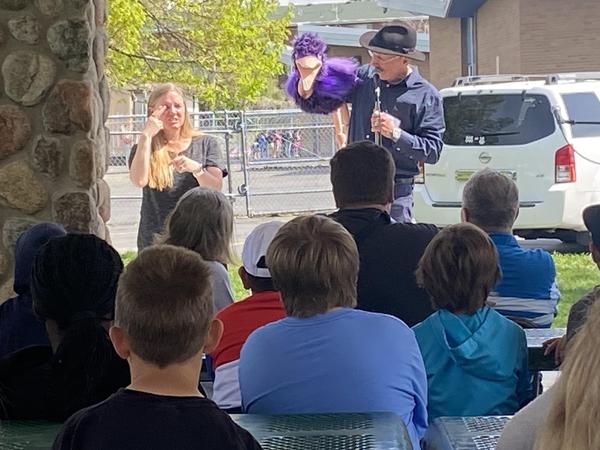 Alan Griffin performing with puppet and ASL interpreter