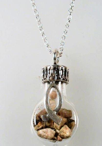 Necklaces with pebbels in a bottle.