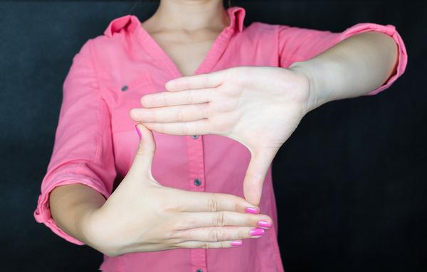 Woman in pink shirt picture hands