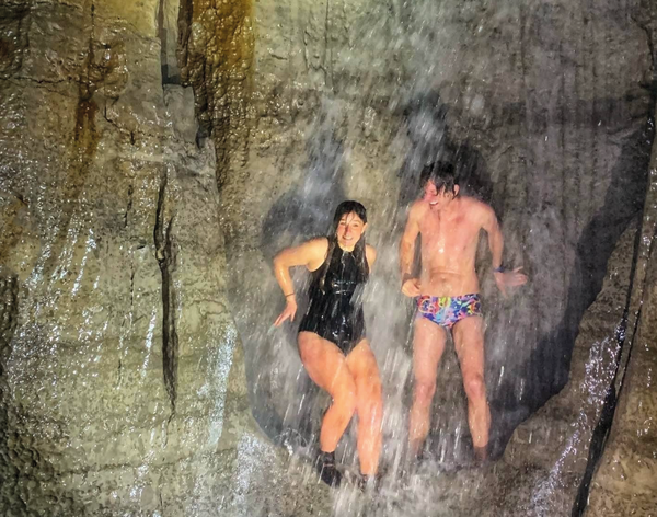 Two swimmers in a cave