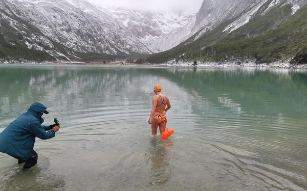 Kate Steels entering an icy lake