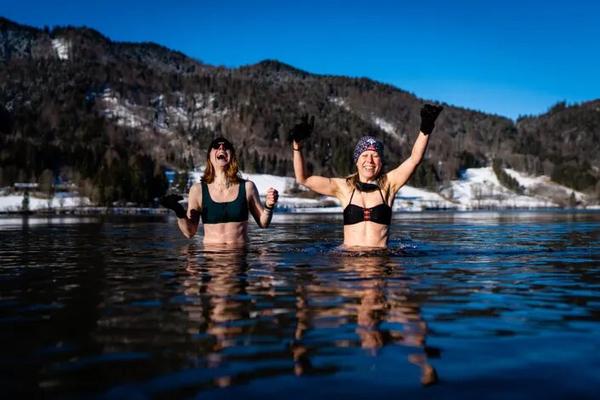 Two people in an icy lake