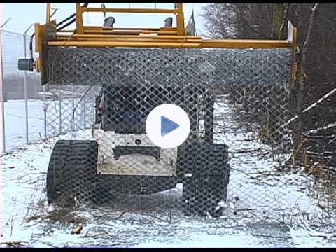 Removing Used Chain Link from SnowRapid Roller removes fence in snow.