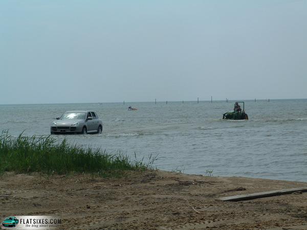 porsche cayenne pulling tractor from Lake