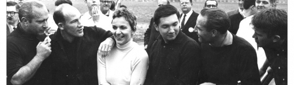 Denise McCluggage with Stirling Moss and others