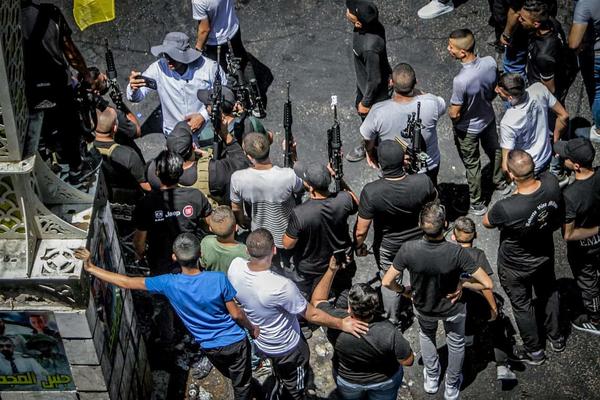 Armed Palestinians march in Jenin