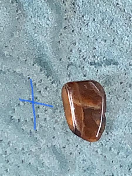 God gave me a Tiger's Eye rock with a cross on it!