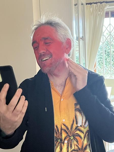 Clovenhoof applying his red greasepaint