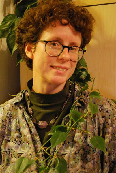 A woman with curly brown hair.