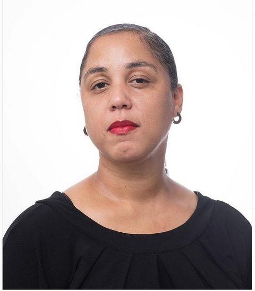 A black woman with a black shirt and red lipstick