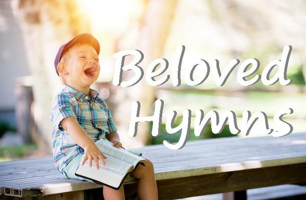 Boy singing on bench