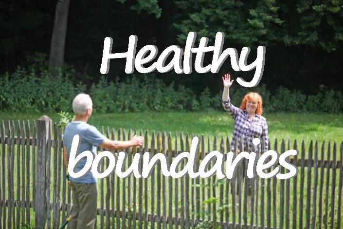 Two people at a picket fence