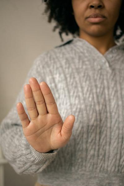 Photo by Monstera Production: https://www.pexels.com/photo/black-woman-showing-palm-in-light-room-7114324/