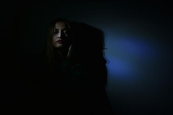 Photo by Dids from Pexels: https://www.pexels.com/photo/photo-of-woman-in-dark-room-1707791/