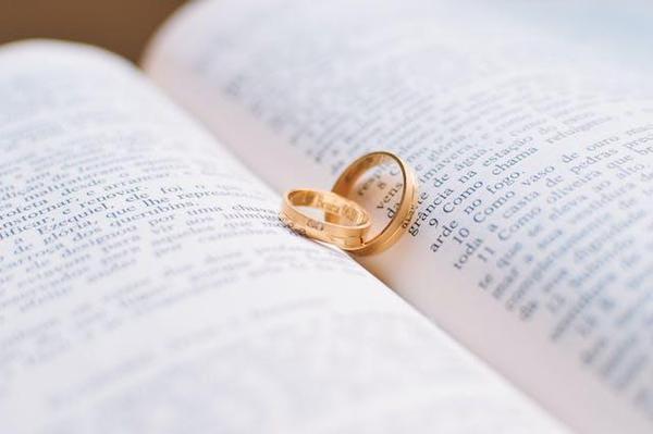 Photo by Caio  : https://www.pexels.com/photo/two-gold-colored-wedding-bands-on-book-page-56926/