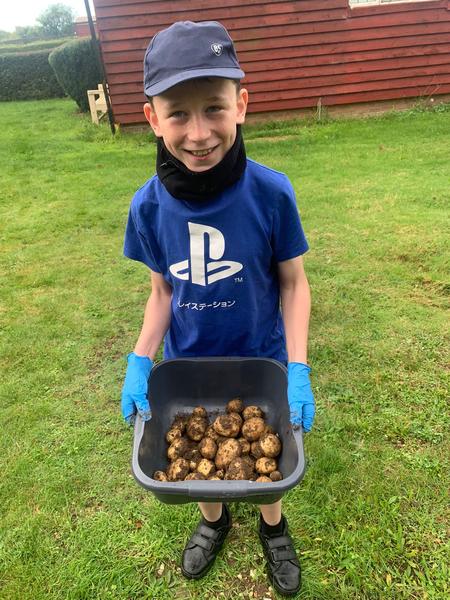 Ben With 39 Homegrown Potatoes