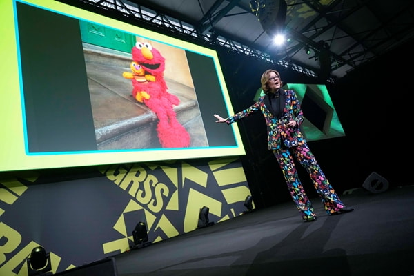 Ann presenting in Belgium, with cameo by Elmo