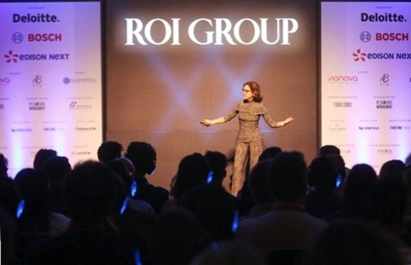 Ann speaking on stage in Milan
