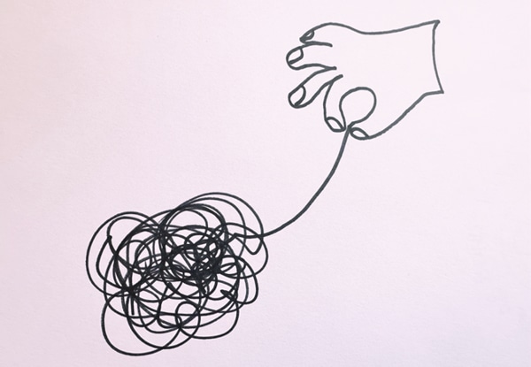 Hand-drawn image of hand untangling a ball of thread