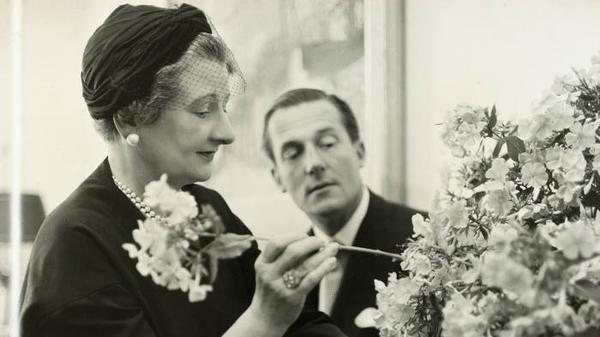 Black and white photo of Constance Spry arranging flowers