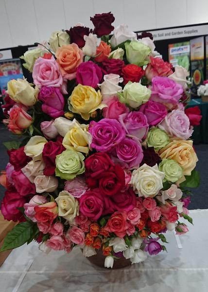 A tall arrangement of mixed roses