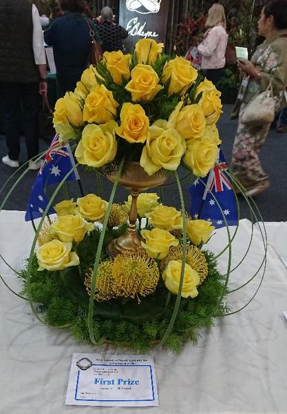 Arrangement of yellow roses with Australian flags