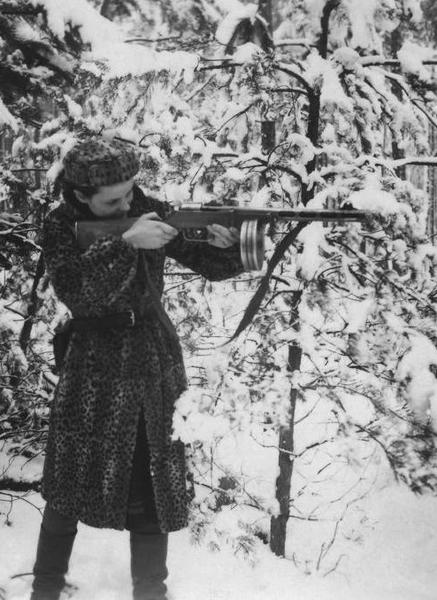 Faye Schulman at rifle practice in early 1943, in the forest near Lenin, Poland