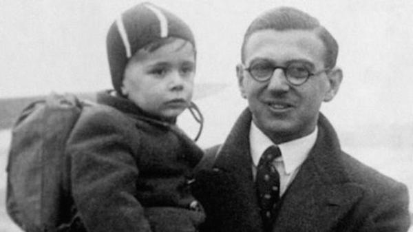 Nicholas Winton carrying Jewish child, 1938.