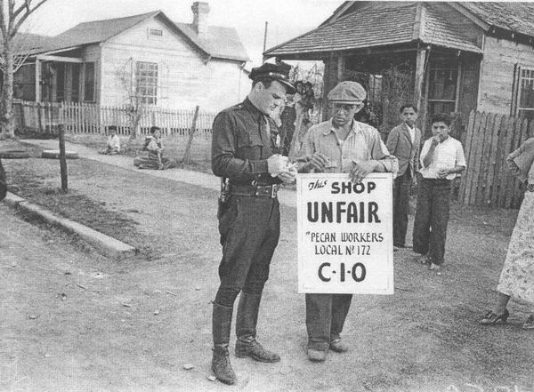 Texas pecan workers outside their home