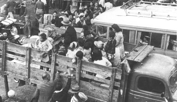 Japanese Canadians loaded into trucks