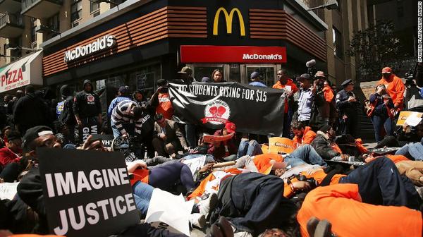 Workers protest at New York McDonald's demanding $15 hr. minimum wage.