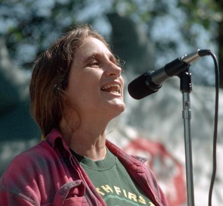 Judi Bari at microphone at a protest.