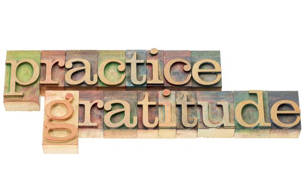 tiles that spell out practice gratitude