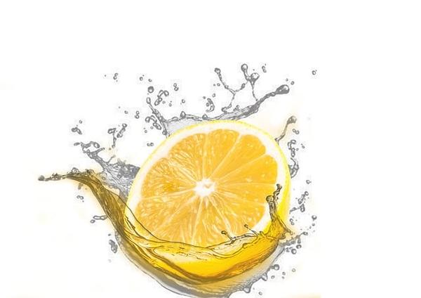 image of lemon slice falling into water with a splash