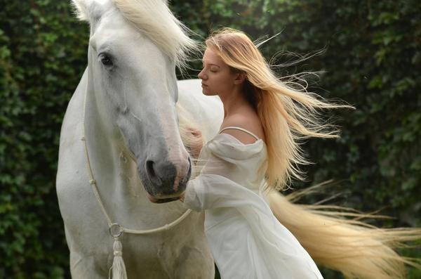 woman in white dress with horse