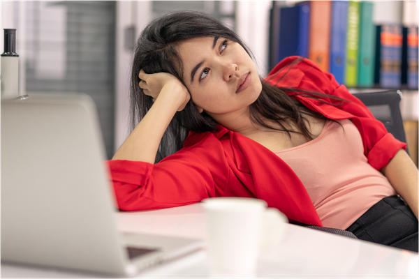 overwhelmed woman at computer